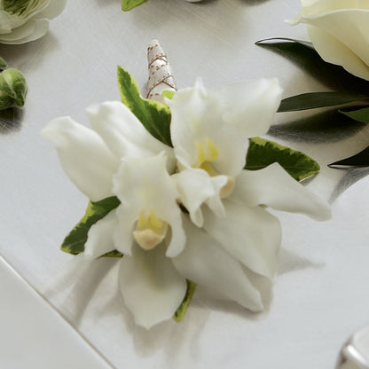 White Mini Cymbidium Boutonniere –  Sanford Floral Marketing, Sanford FL